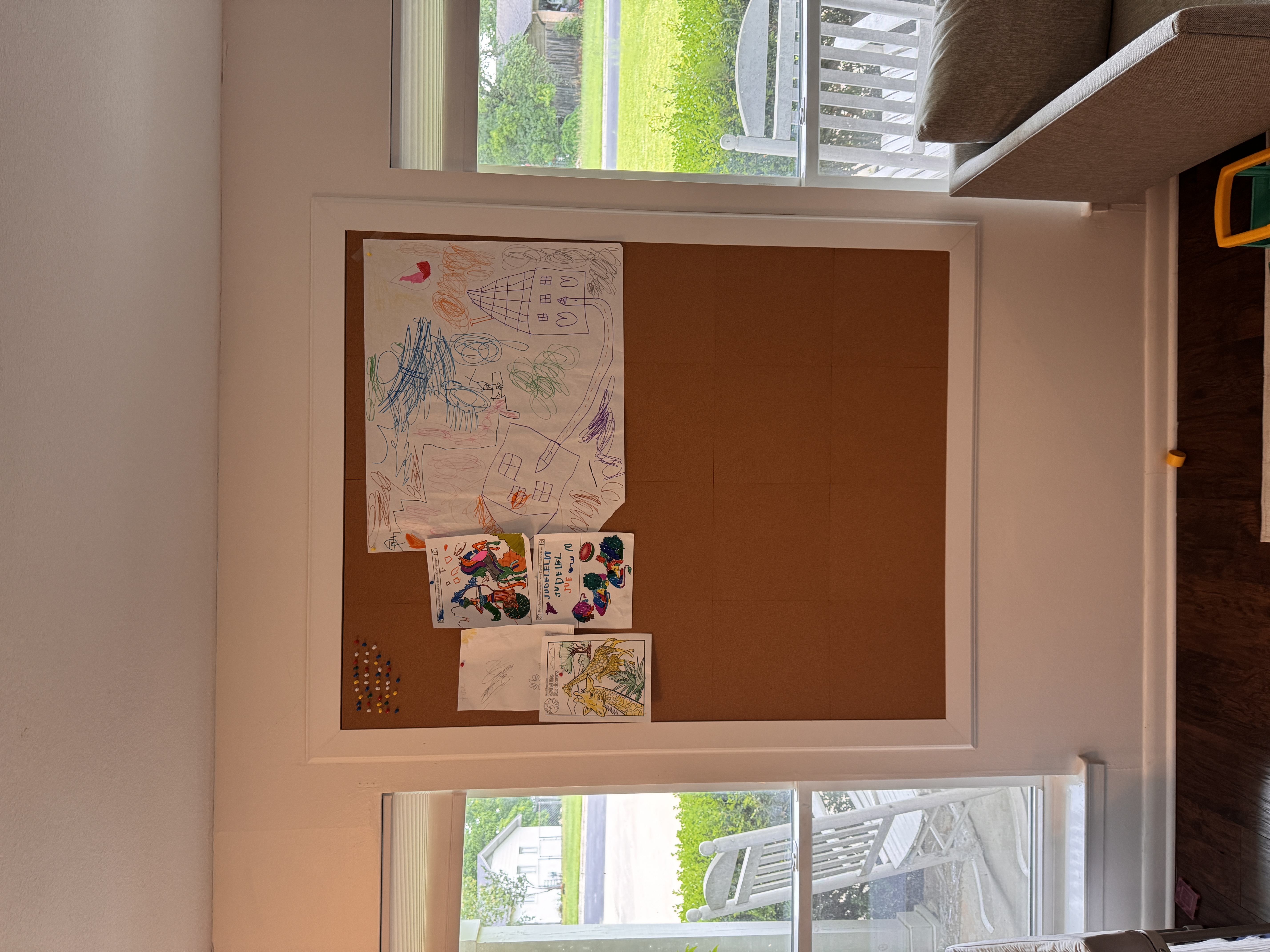 Custom cork board installed between windows in an Austin home