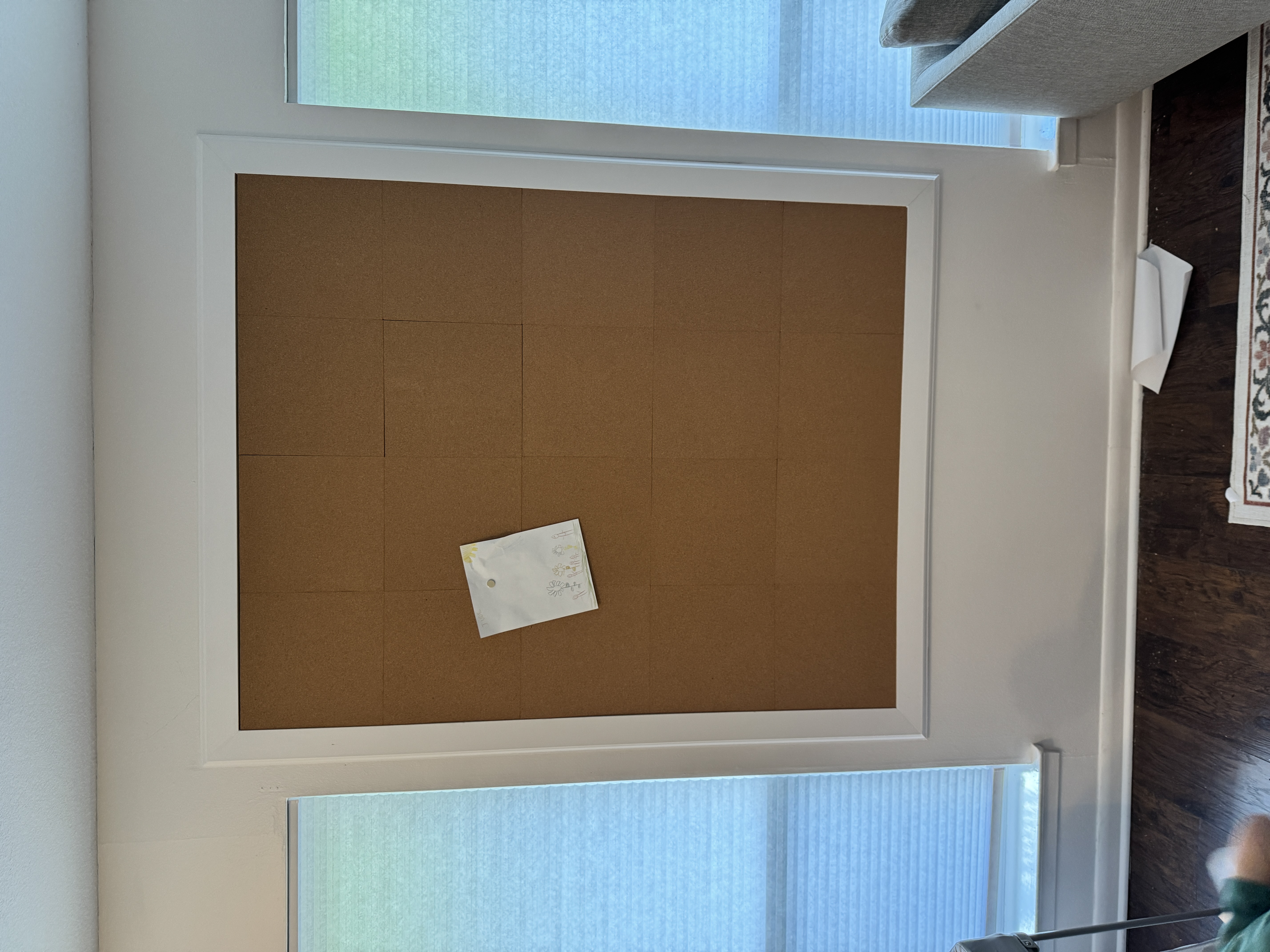 Natural cork tiles being applied to create the finished surface